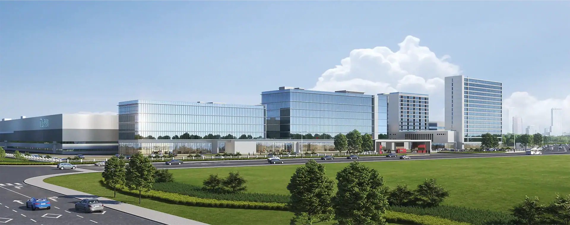 Bright and modern office complex with extensive glass windows and green outdoor spaces.
